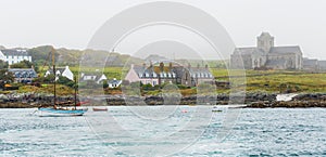 Vintage schooner sailboat moored close to Iona Abbey