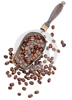 Vintage scoop with coffee beans isolated on white