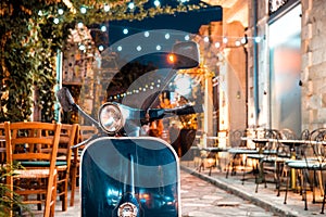 Vintage scooter parked at the narrow street in Old Ton of Limassol. Cyprus