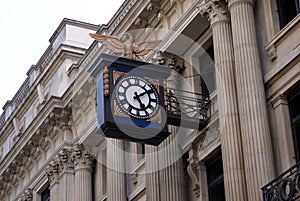 Vintage sculptured old clock on a facade