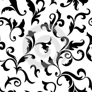 Vintage seamless pattern. Black luxurious Vegetative tracery of stems and leaves isolated on a white background.