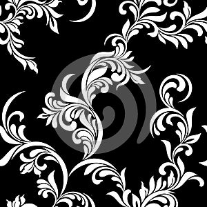 Vintage seamless pattern. White luxurious Vegetative tracery of stems and leaves on a black background.