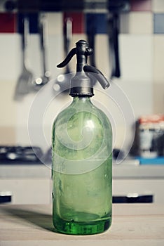 Vintage seltzer bottle on table