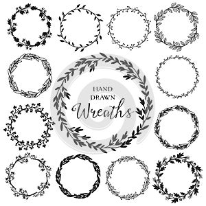 Vintage set of hand drawn rustic wreaths. Floral vector graphic.
