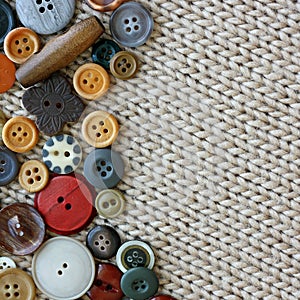 Vintage Sewing Buttons Framing Fabric Background
