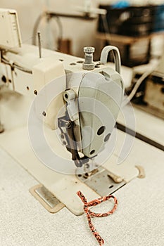 Vintage sewing machine in a room, with its details of the machinery on display