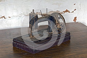 Vintage sewing machine on rustic wood table