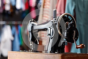 Vintage sewing machine with thread in workshop, closeup