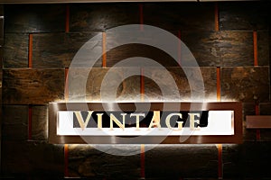 Vintage Sign With Back Light on Rustic Wall