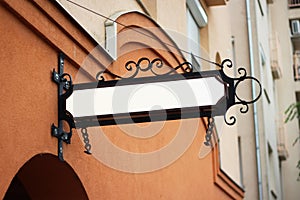 Vintage sign mounted on a wall for advertising mockup. Template for logo, branding and corporate identity of shop, cafe,