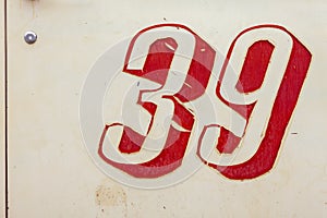 Vintage sign with peeling number thirty-nine