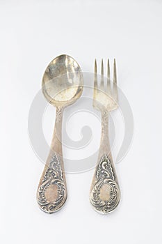 Vintage silver fork and spoon on white background