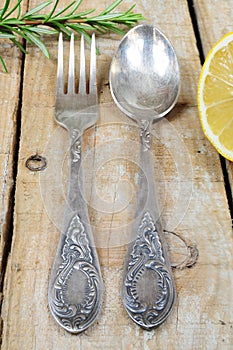 Vintage silver fork and spoon on wooden background