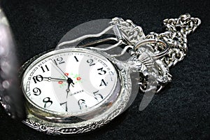 Vintage Silver Pocket Watch close up on black background