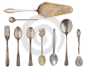 Vintage Silverware, antique spoons, knives, cake shovels isolated on isolated white background. Antique silverware. Retro