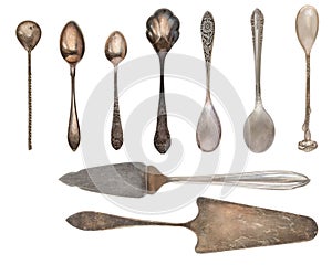 Vintage Silverware, antique spoons, knives, cake shovels isolated on isolated white background. Antique silverware. Retro