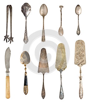 Vintage Silverware, antique spoons, knives, cake shovels isolated on isolated white background. Antique silverware. Retro