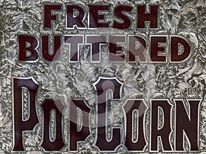 Vintage Silvery Sign with Words Fresh Buttered Popcorn