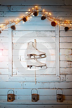 Vintage skates on the wall as a New Year`s decor.