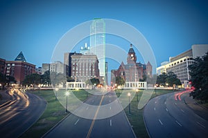 Vintage skyline and light trail traffic over Dealey Plaza in Dallas, Texas