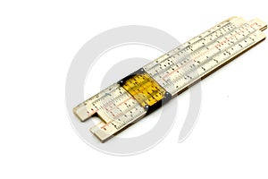 vintage slide rule being used for calculation.