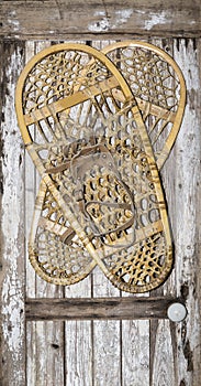 Vintage snow shoes winter sport painted wood door decoration photo