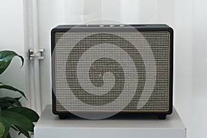 Vintage speaker on the white wall in the house