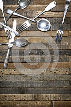 Vintage spoons forks and knives wooden background flat lay instagram mockup photo