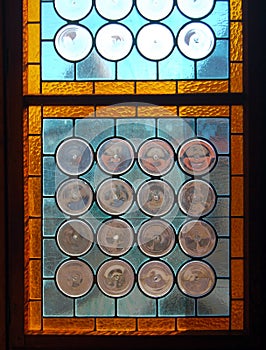 Vintage stained-glass window in old castle interior