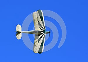 Vintage Stampe SV4C Biplane G-BPLM  in flight against Blue Sky. photo