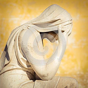 Vintage statue of a crying woman