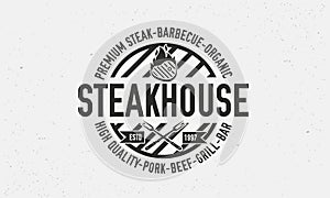 Vintage Steakhouse Logo. Steak grill retro logo template. Barbecue restaurant emblem. Vector Illustration.