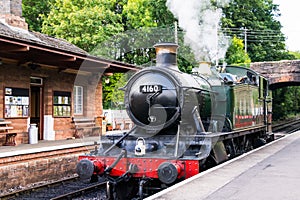 Vintage steam locomotive 4160 at Bishops Lydeard station in Somerset photo