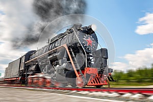 vintage steam train hurtling at speed along the rails, retro vehicle, steam