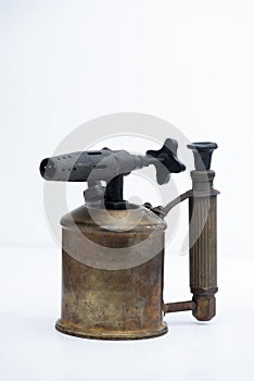 Vintage steel blowtorch on the white background