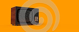 vintage steel and metal television levitating on an orange background, noise in the screen