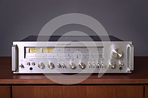 Vintage Stereo Receiver Standing on the Wooden Sideboard, Frontal View