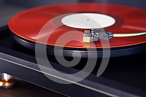 Vintage Stereo Turntable Plays Red Vinyl Record Album, Tonearm with Headshell