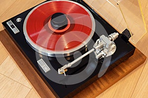Vintage Stereo Turntable Record Player With Colored Disk and Weight Clamp