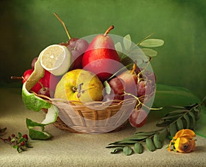 Vintage still life with basket of fruits over blur background