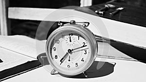 Vintage still life with old alarm clock, keys and books