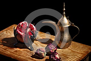 Vintage still life with pomegranate and teapot