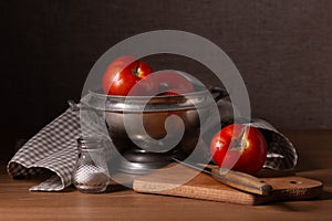 Vintage still life with red ripe tomatoes