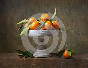 Vintage still life with tangerines photo