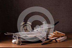 Vintage still life with a tureen and clock