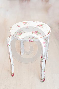 Vintage stool with flowered design