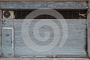 Vintage store or shop with closed metal shutter