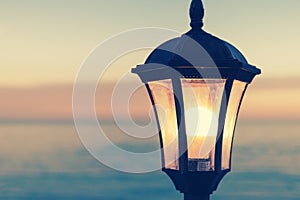 Vintage street lamp on the background of the sea