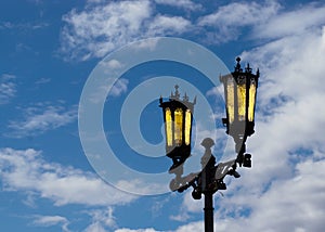 Vintage street lamp in Troitsk against the sky