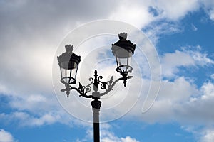 vintage street light on beautiful cloudy sky background